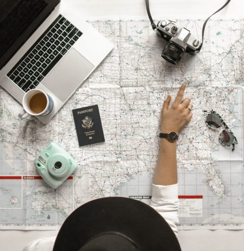 person pointing at map w camera